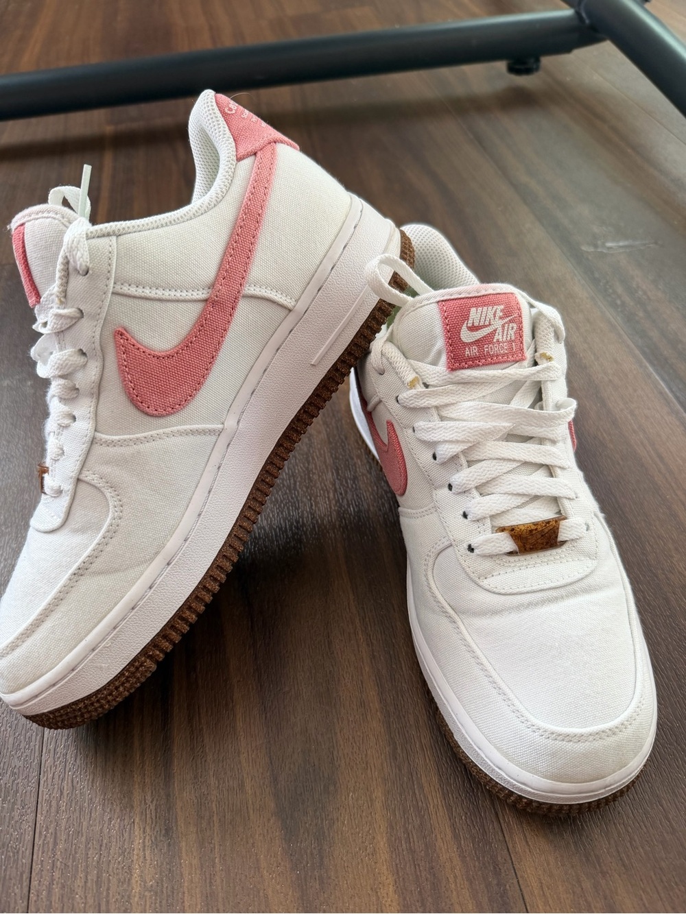 Nike Women's White Canvas Sneakers with Pink Swoosh and Brown Outsole